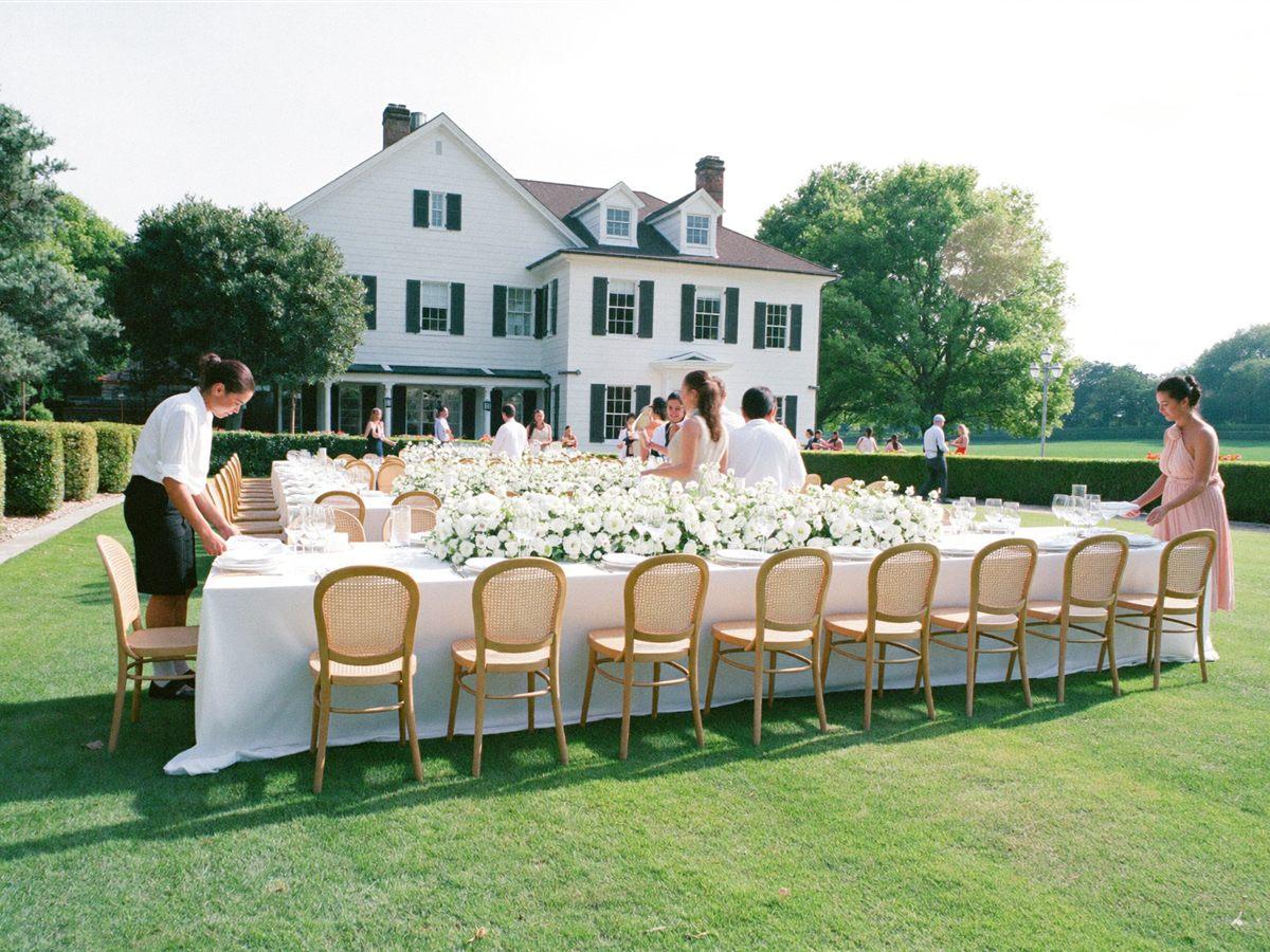 A garden wedding reception table at a bright venue